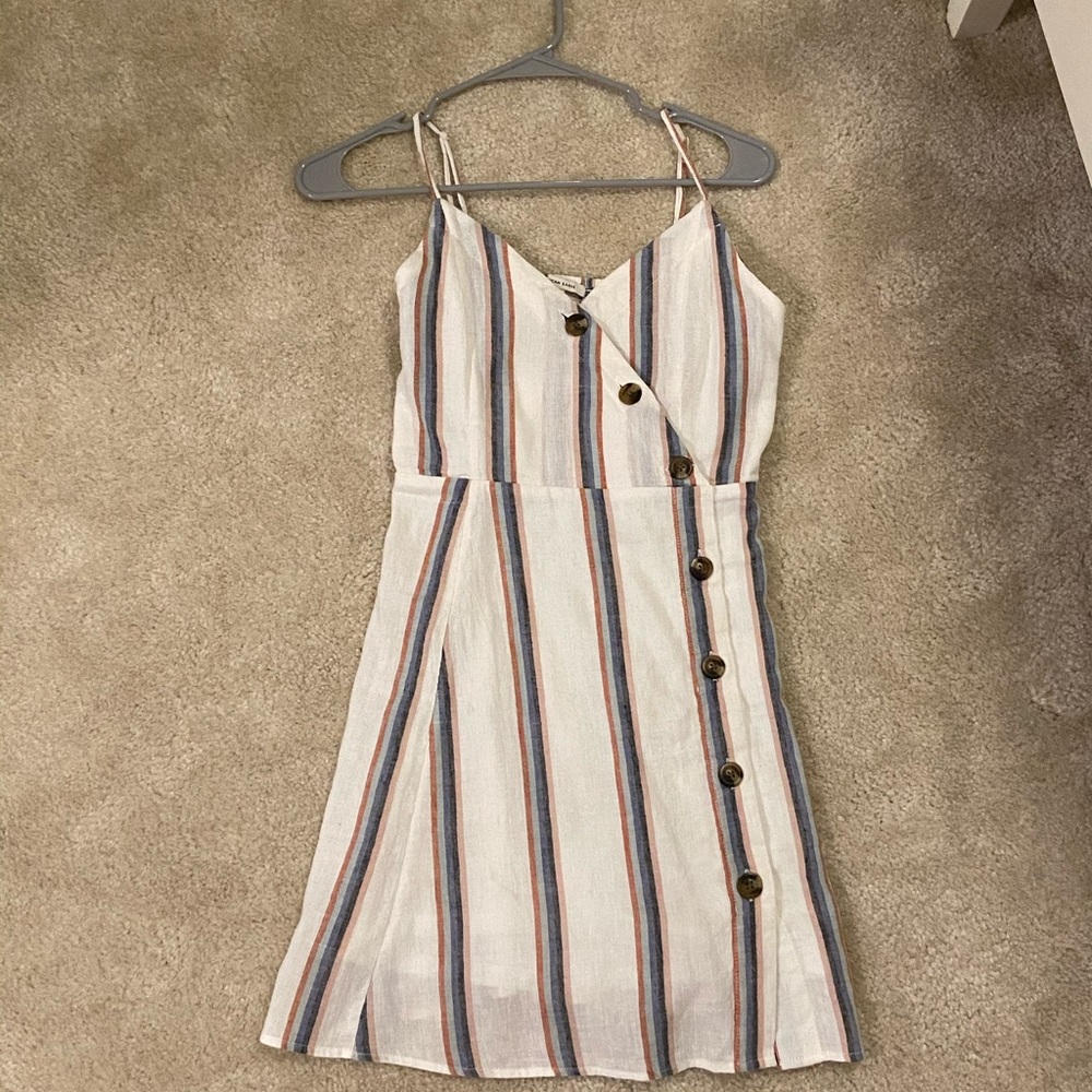 white dress with stripes down it
